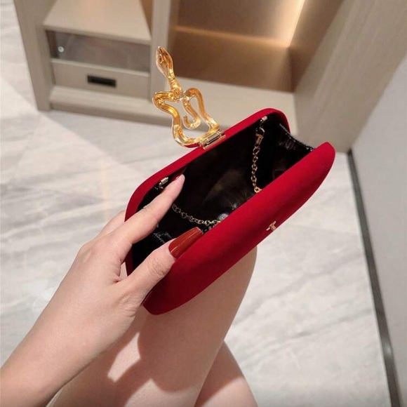 Elegant Red Clutch with Gold Snake Design  Accent